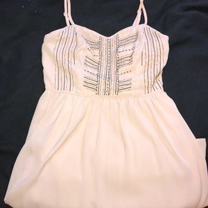 nude fit and flare dress with cutout in back